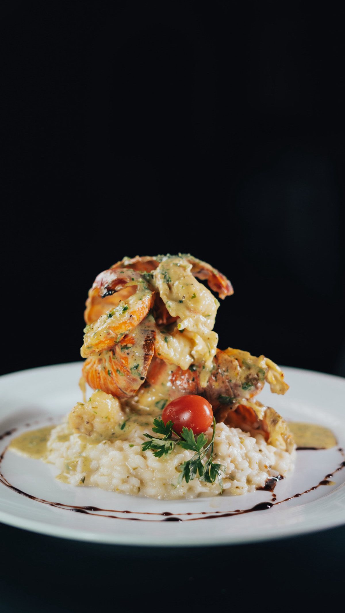 Risotto de lagosta finalizado à mesa no Caravaggio